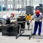 RICHI Machinery workers fabricating pellet mill equipment in the production workshop