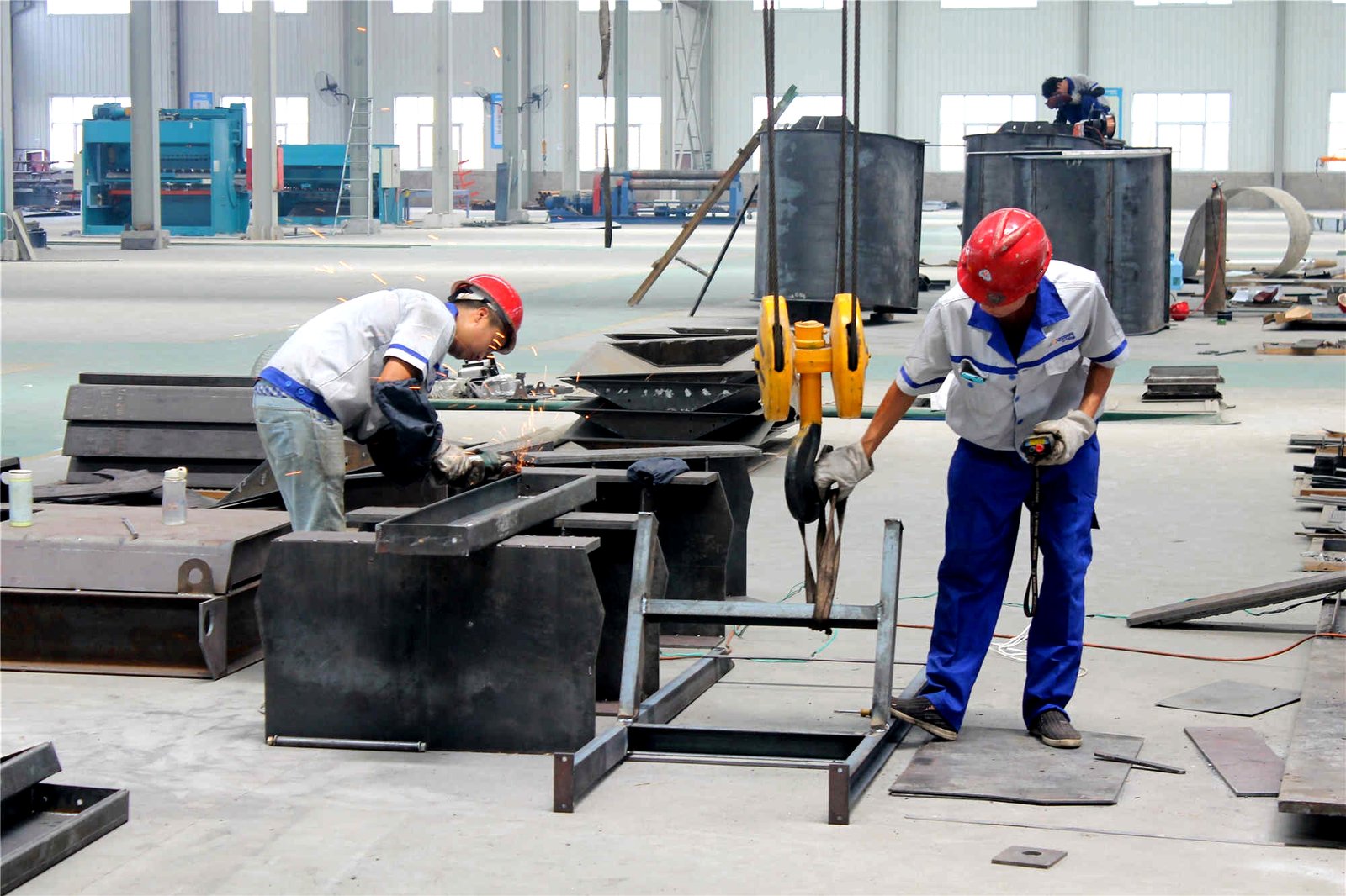 RICHI Machinery workers fabricating pellet mill equipment in the production workshop